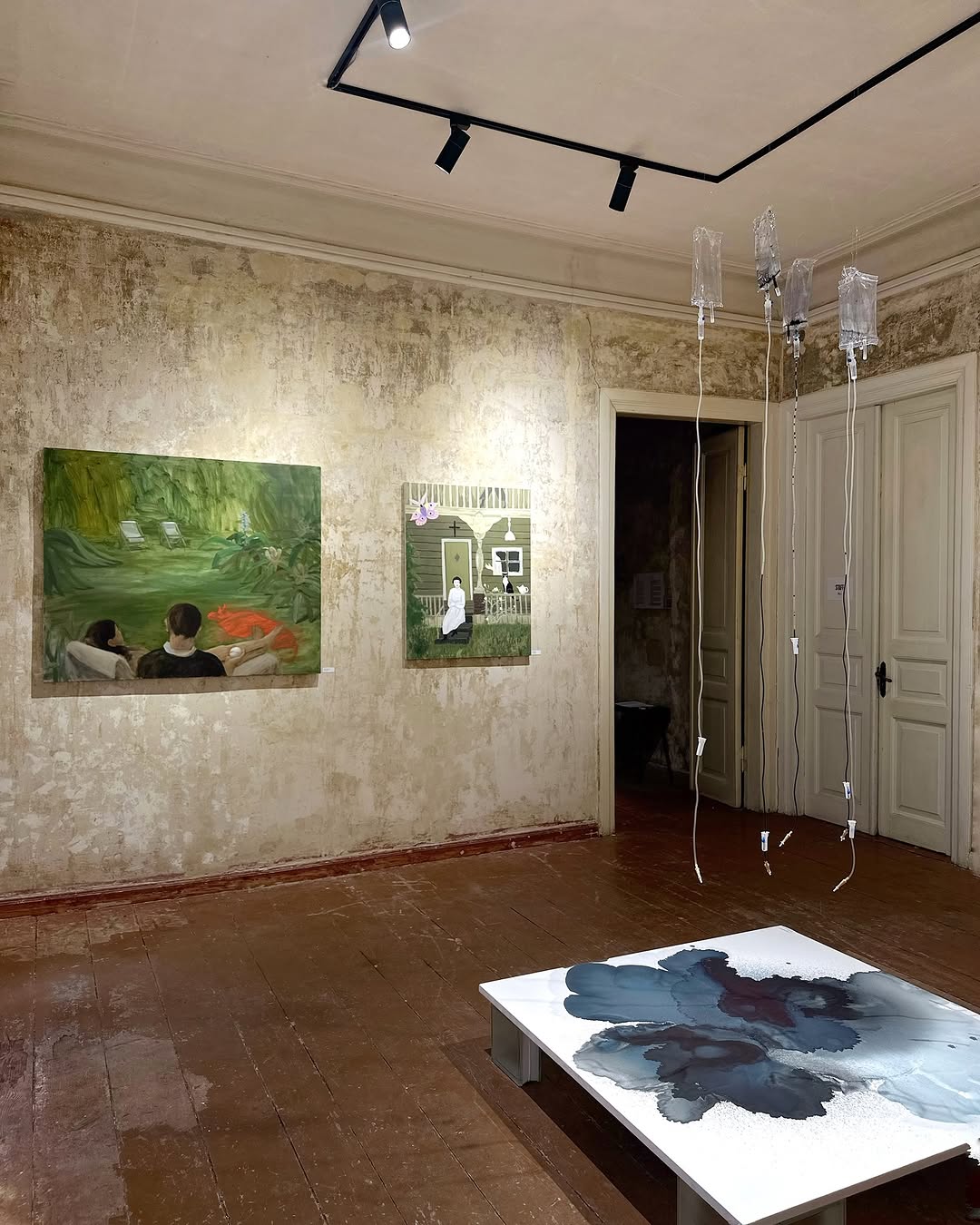 New Locality — wide installation view, paintings hung on textured walls