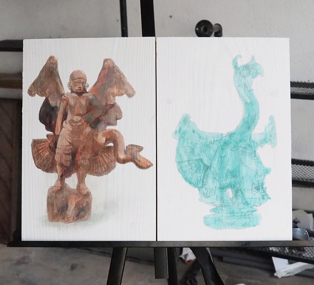 Portable Figurines — two painted wooden panels on easel, winged figure and green dragon